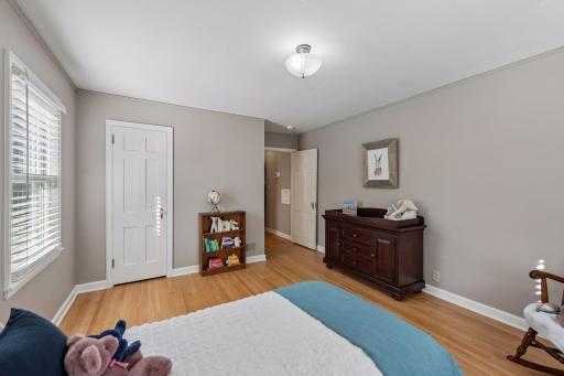 Bedroom - Reverse view highlights the hardwood floors, closet, natural light, and ample wall space in this comfortable bedroom.