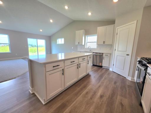 The Finnegan Kitchen shown with White cabinets at Highlands at Eagle View in Elko New Market. Photo is of actual home. Options and colors may vary. Ask Sales Agent for details.