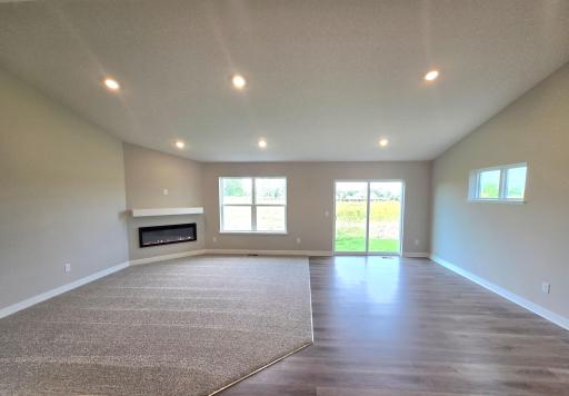 The Finnegan Main Floor Living and Dining Rooms at Highlands at Eagle View in Elko New Market. Photo is of actual home. Options and colors may vary. Ask Sales Agent for details.