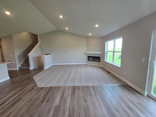 The Finnegan Main Floor Living and Dining Rooms at Highlands at Eagle View in Elko New Market. Photo is of actual home. Options and colors may vary. Ask Sales Agent for details.