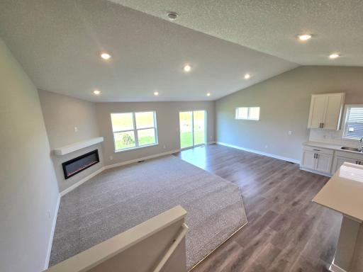 The Finnegan Main Floor Living and Dining Rooms at Highlands at Eagle View in Elko New Market. Photo is of actual home. Options and colors may vary. Ask Sales Agent for details.