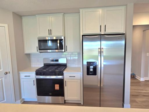 The Finnegan Kitchen at Highlands at Eagle View in Elko New Market. Photo is of actual home. Options and colors may vary. Ask Sales Agent for details.
