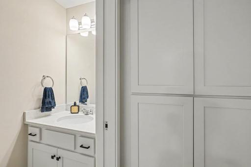 Main level powder room right off the garage.