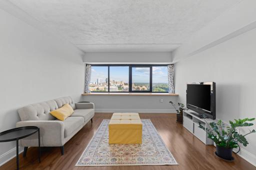 Living room view with wide windows showing Minneapolis