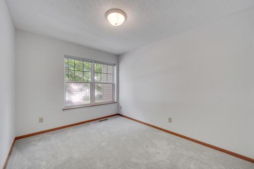 A second AND third bedroom and full bathroom complete the upper level, providing plenty of room for guests or creative use.