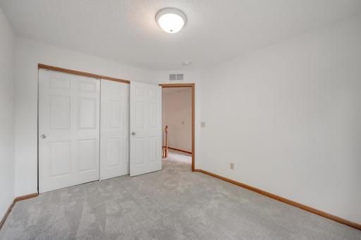Another view of the second bedroom situated on the upper level.