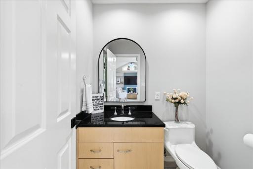 Powder room between living room and lakeside family room,