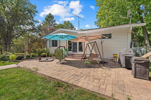 Large fenced patio with beauitful gardens