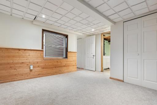 Lower Level Bedroom into Laundry and Bathroom