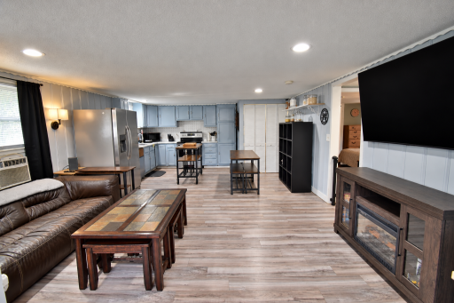 Open-concept living space (AI used to remove personal items only)