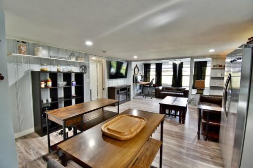 Kitchen overlooking open living area (AI used to remove personal items only)