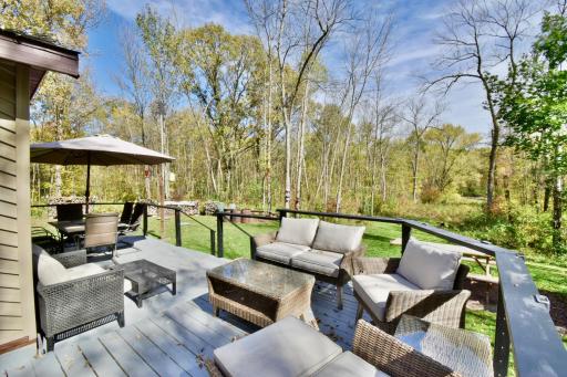 Spacious deck overlooking the wooded property
