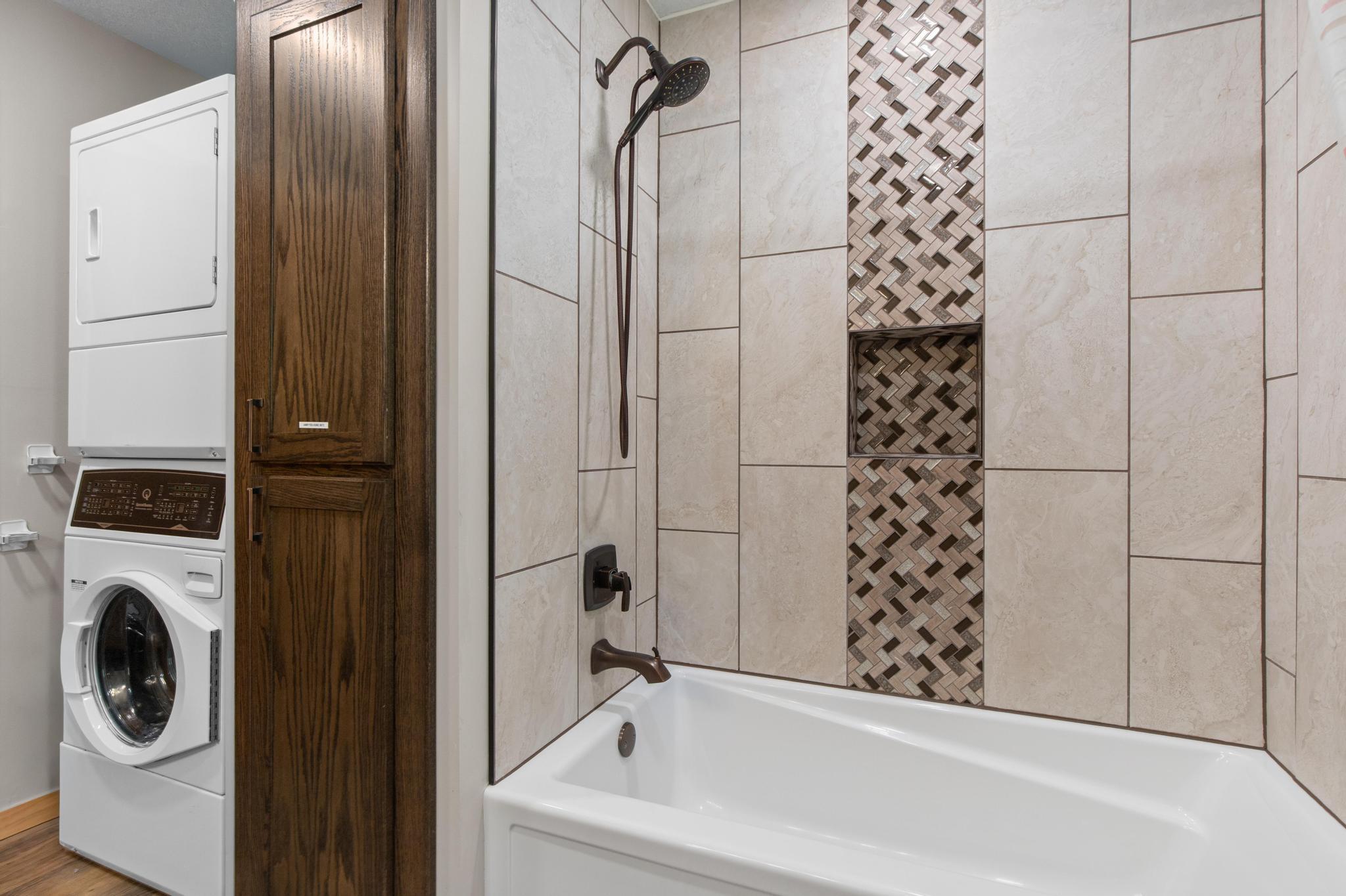 Stunning tile work with main floor laundry.