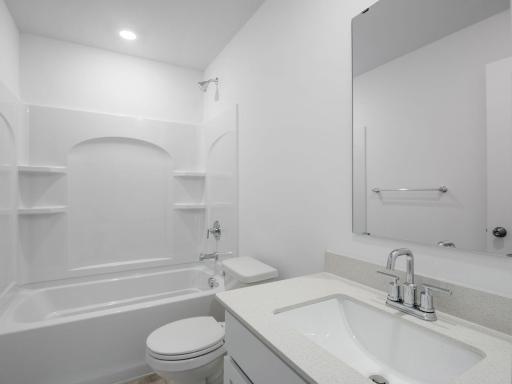 A full bathroom on the lower level offers greater convenience, perfect for long-term guests