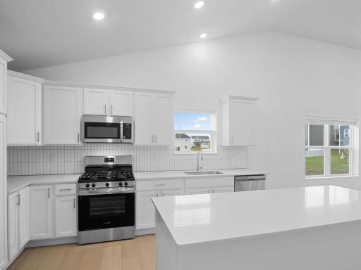 Spacious quartz countertops and brand-new stainless steel appliances will elevate culinary endeavors