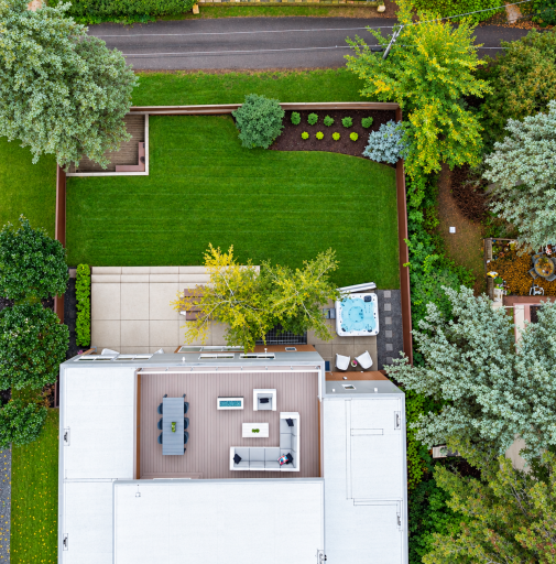 The spacious lawn has been meticulously landscaped.