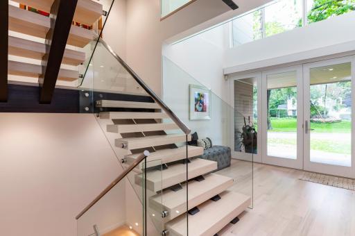 The focal point of the main floor is the custom floating staircase, which is carried across all four levels.