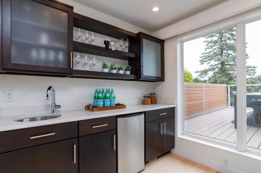 The third floor with rooftop deck is the perfect place to entertain with a wet bar, half bathroom and the best views in Saint Paul!