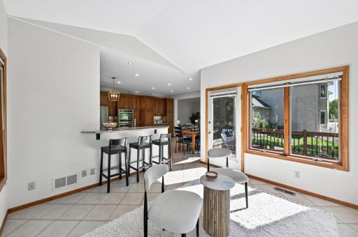 sunroom looking back into kitchen and living room