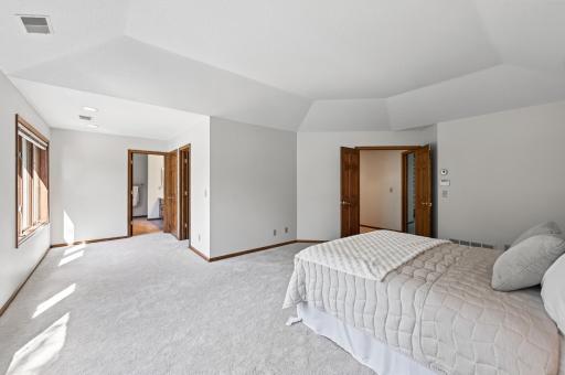 primary suite with sitting area and walk in closet