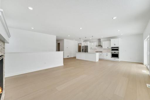 (Photo of a similar home, actual finishes may vary) The open floorplan allows for seamless flow throughout the home.