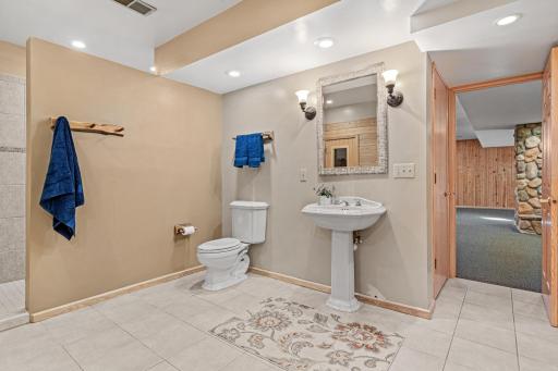 Beautifully updated 3/4 bathroom includes a walk-in shower and enormous sauna.