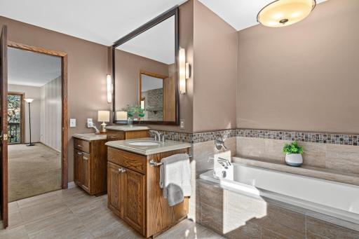 Retreat to the beautifully updated owner's suite at the end of the day.