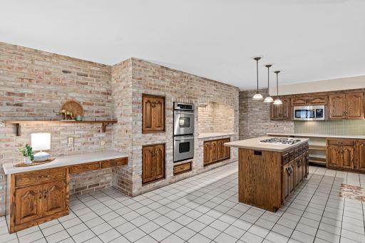 Spacious kitchen with plenty of room for meal preparation and everyday living. Beautiful brick anchors the room and provides great character.