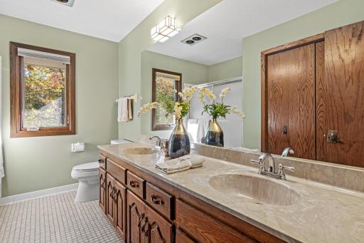 Oversized full bathroom upstairs includes a double vanity, large shower and linen closet.