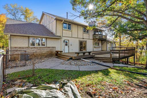 Step outside to the expansive deck overlooking the private, fenced backyard.