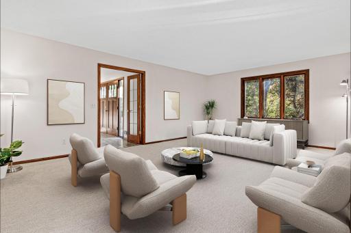 The formal living room is a beautiful gathering space for conversation, entertaining or simply relaxing. Visually staged to show one potential configuration.