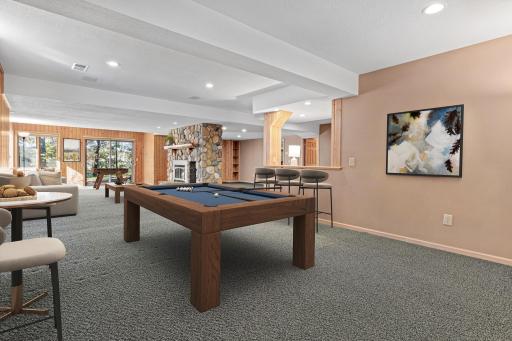 Plenty of space for a card table, games and memorable gatherings. Visually staged lower level to show a potential configuration.