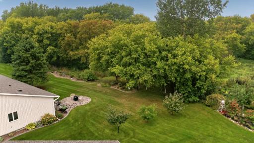 Ariel shot of the gorgeous wooded lot (beautiful year round!). There is a walking trail to extend your lifestyle outdoors.