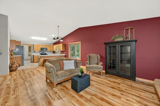 Enter into the large open and bright floor plan with vaulted ceilings and beautiful new flooring.