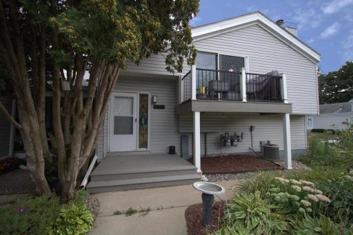 Front with gardens on each side of the sidewalk