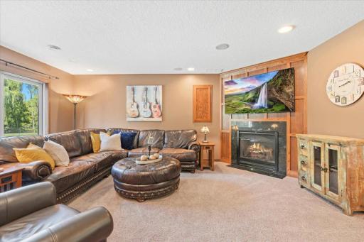 Lower Level Family Room with another cozy gas fireplace