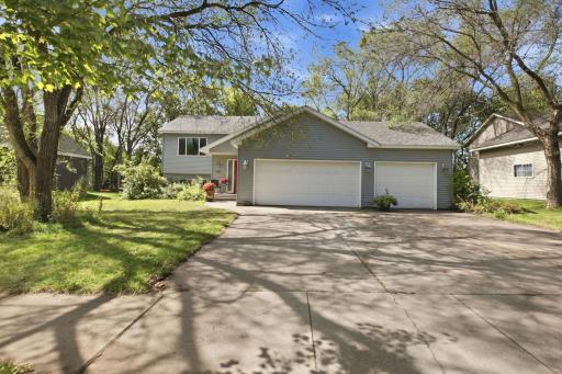 3 car garage & Concrete Driveway