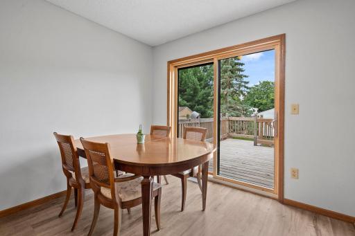 Spacious informal dining walks out to deck. New patio door in 2025!