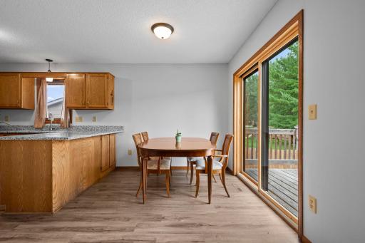 Spacious informal dining seamless open to kitchen and walkout to backyard deck.