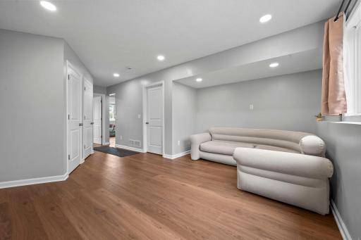Beautiful mix of LVP flooring, white woodwork and doors!