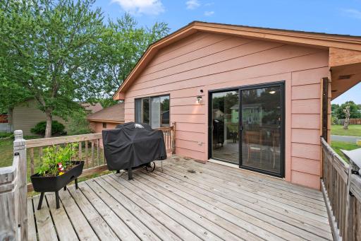 Fabulous deck retreat overlooking large backyard.