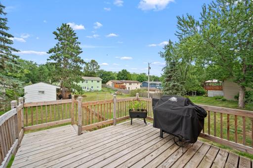 Fabulous deck retreat overlooking large backyard.