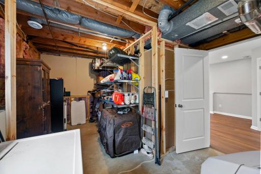 Large utility / laundry room offers great storage.