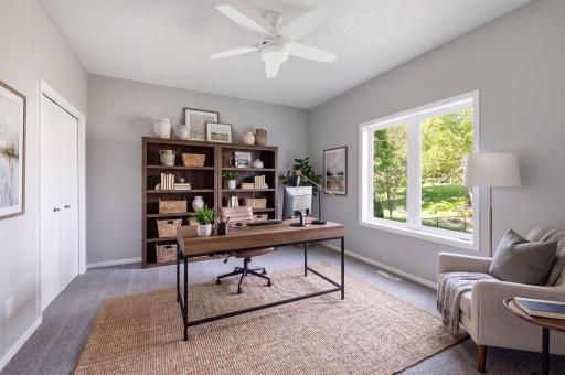 Main floor bedroom/office virtually staged as an office