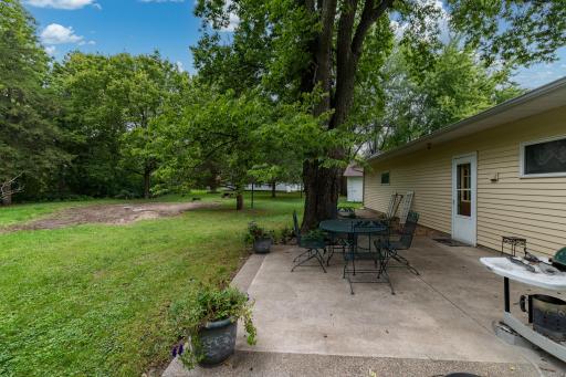 The patio is located at the back of the house, beautifully shaded!