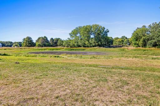 3.58 acres, lots of mature trees on the parameter, and a pond forms here when precipitation is abundant. Ducks and other fowl visit throughout the year.