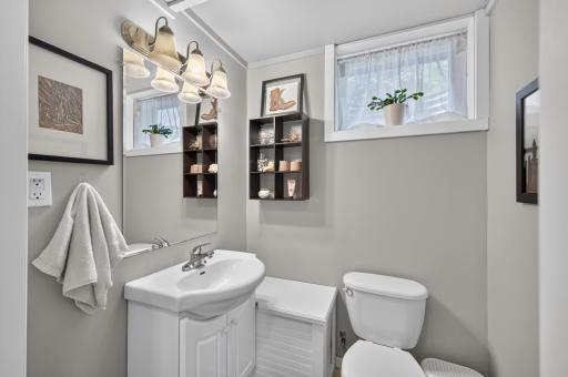 Convenient 1/2 Bath on lower level. It would be very easy to add a shower here.