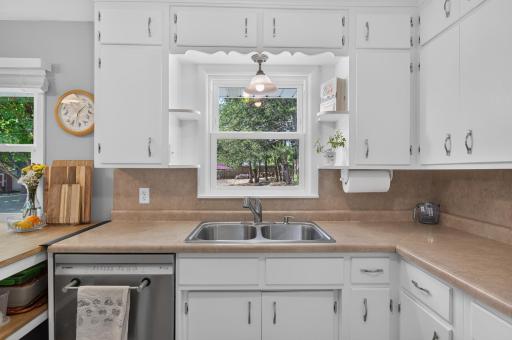 Both windows in the Kitchen overlook your beautiful backyard.