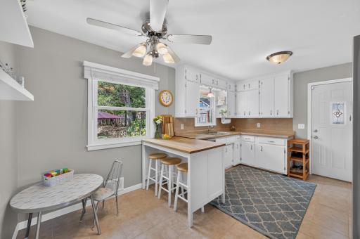 Eat in Kitchen with "floating" butcherblock peninsula/island offers extra seating and work/prep space options.