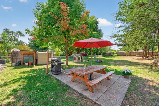 Let's go out back to your perfect oasis! You will love the flat, fenced yard and patio!